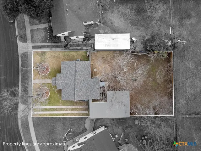 a picture of a bench in front of a wall