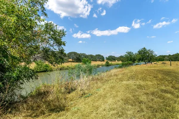 a view of lake with green space
