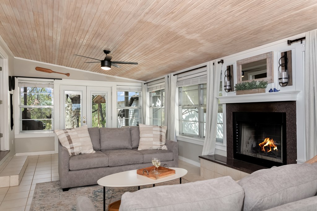 229 Ranch Road 1 Stonewall, TX 78671 - Photo 6 of 25 a living room with furniture and a fireplace