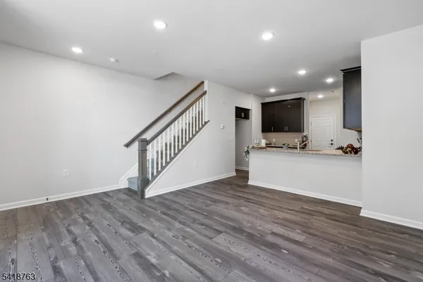 a view of kitchen with microwave and cabinets