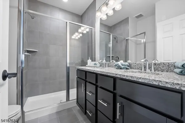 a view of a storage & utility room with two washing machine