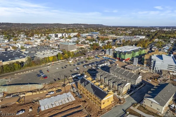 an aerial view of residential building and parking space