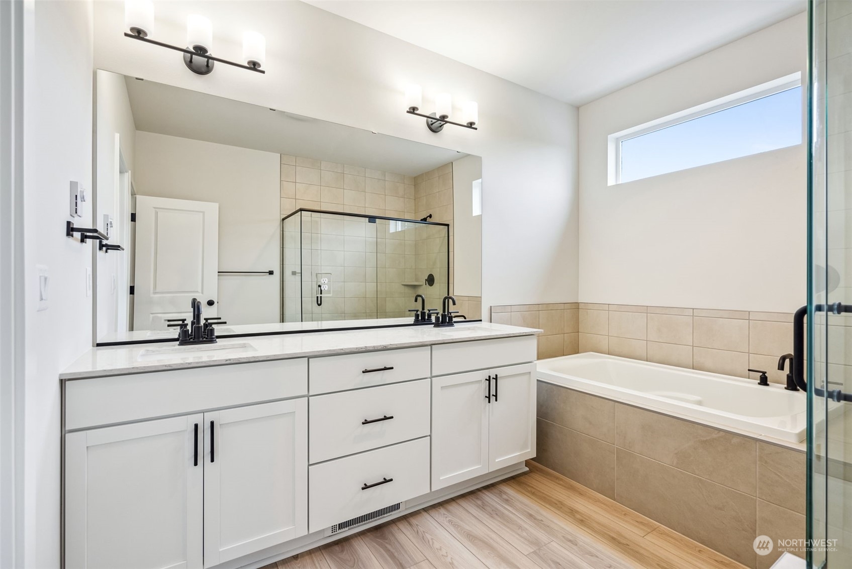 4010 Aberdeen Place Northeast, Unit 31 Renton, WA 98056 - Photo 19 of 35 a bathroom with a double vanity sink a mirror and a bathtub