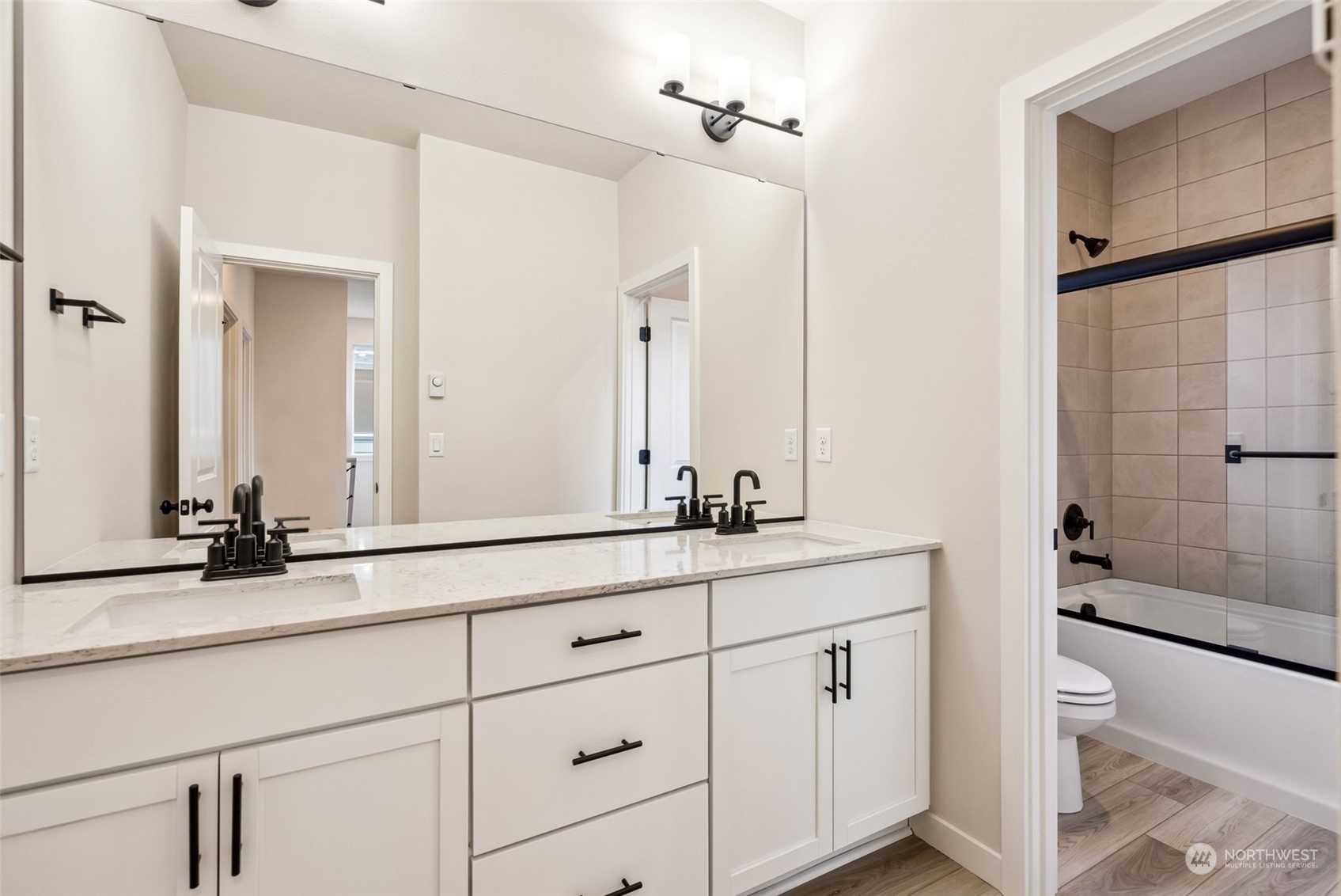 4010 Aberdeen Place Northeast, Unit 31 Renton, WA 98056 - Photo 23 of 35 a bathroom with a double vanity sink toilet mirror and bathtub