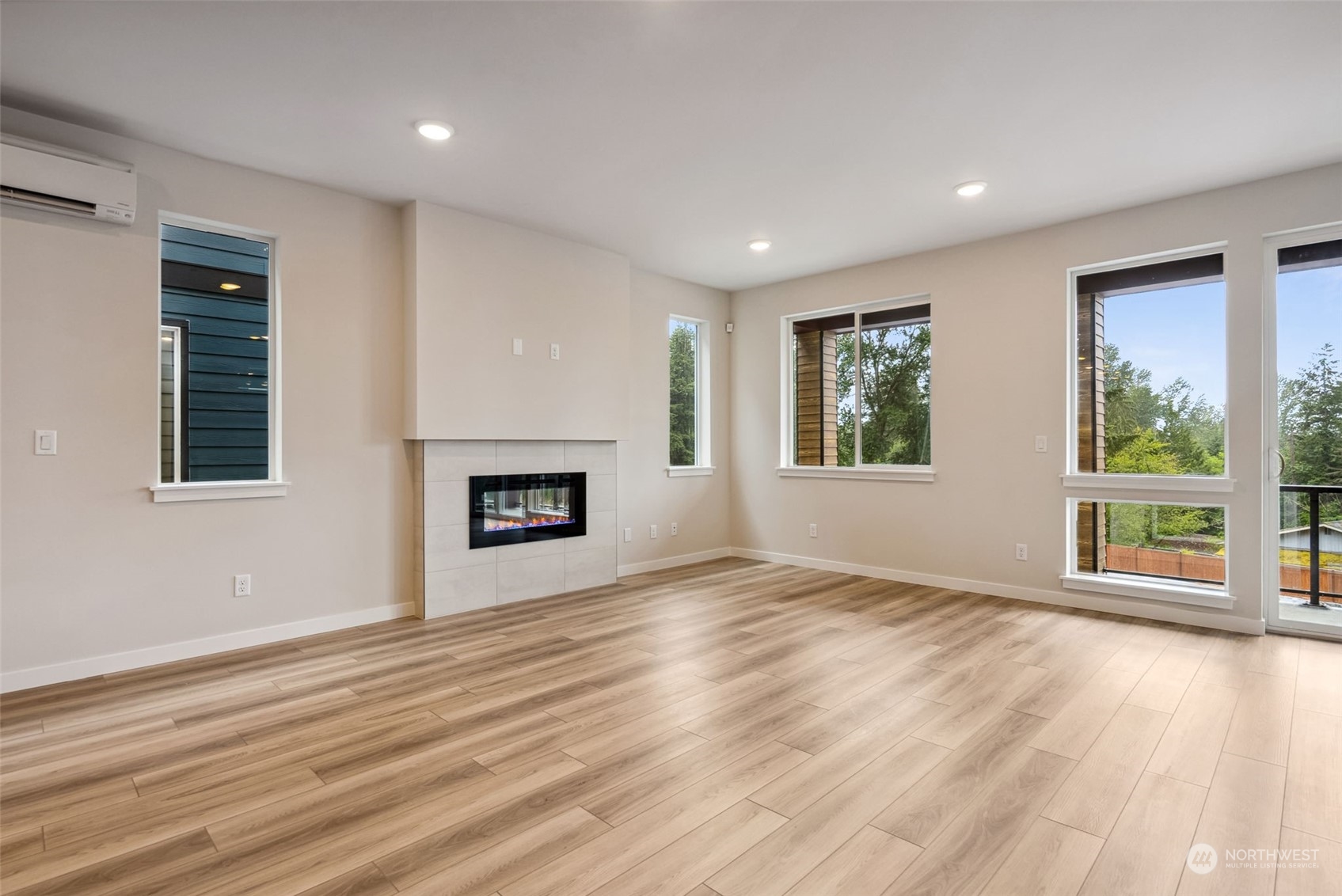 4010 Aberdeen Place Northeast, Unit 31 Renton, WA 98056 - Photo 10 of 35 a view of an empty room with wooden floor and a window