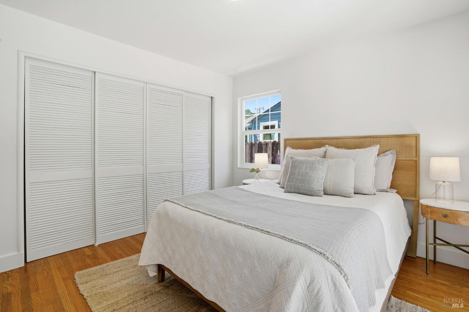 234 Solano Street San Rafael, CA 94901 - Photo 10 of 24 a bed room with a bed and a night stand