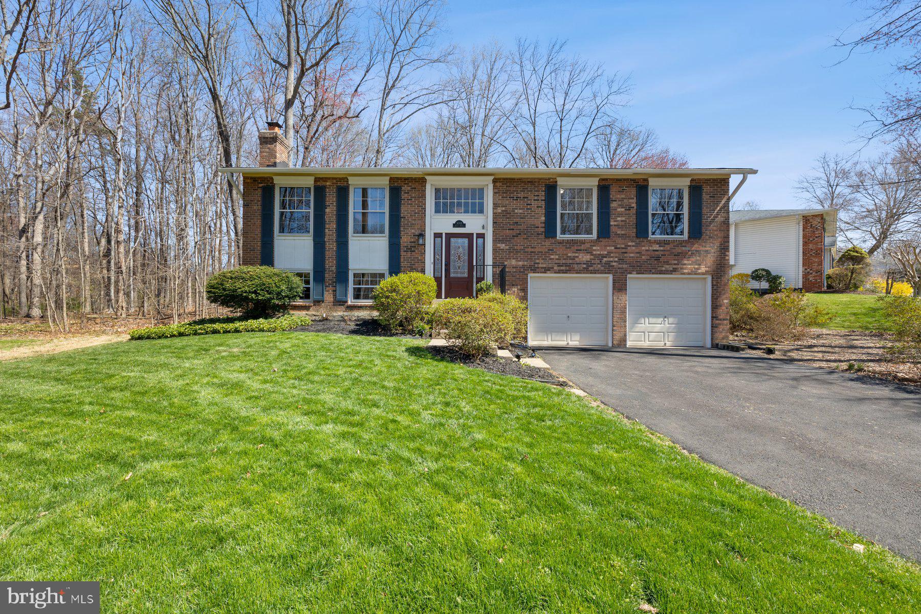 a view of a house with a yard and plants