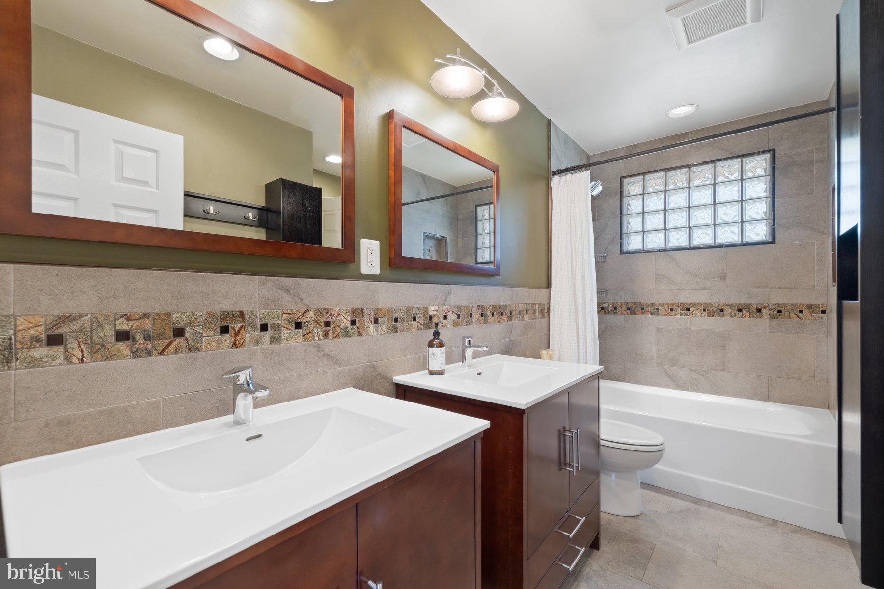9008 Arley Drive Springfield, VA 22153 - Photo 19 of 40 a bathroom with a sink and a mirror
