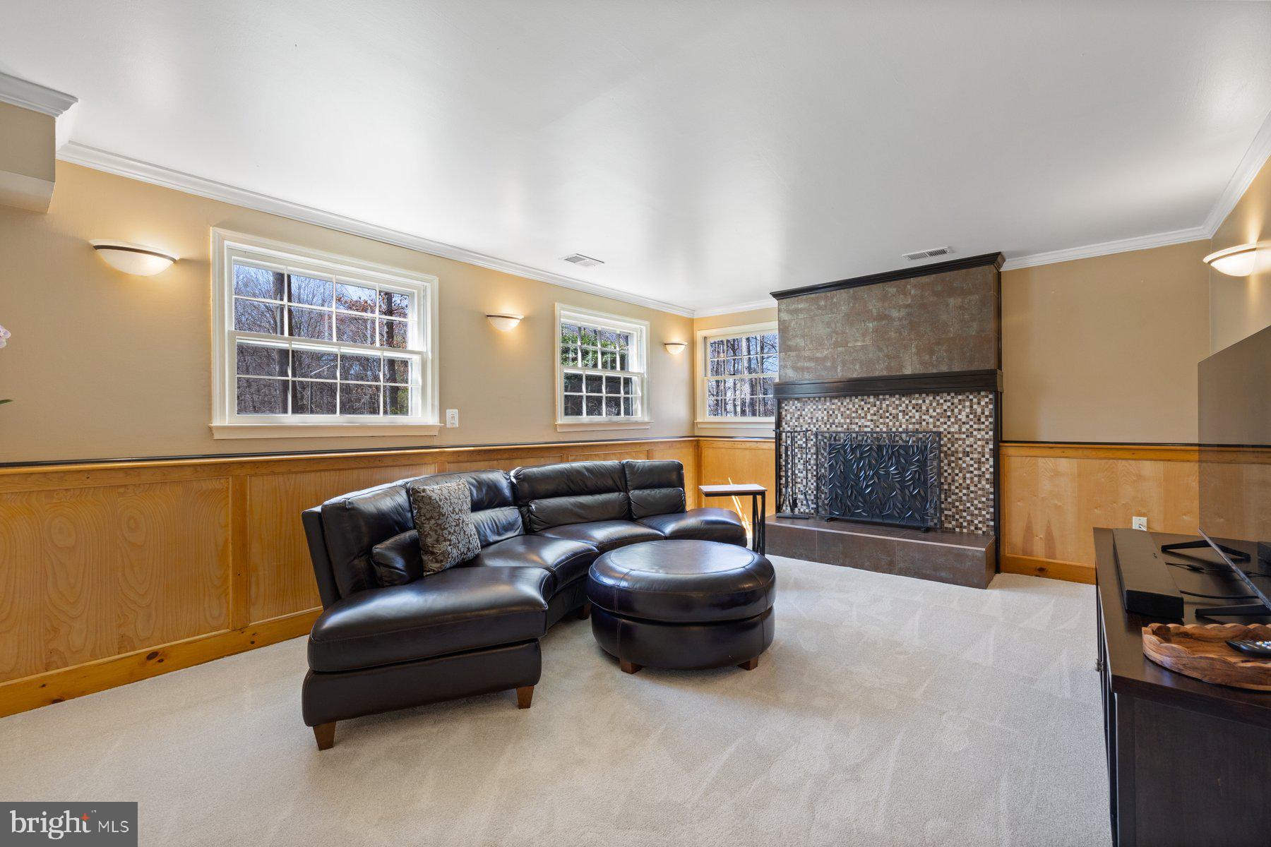 9008 Arley Drive Springfield, VA 22153 - Photo 25 of 40 a living room with furniture and a flat screen tv