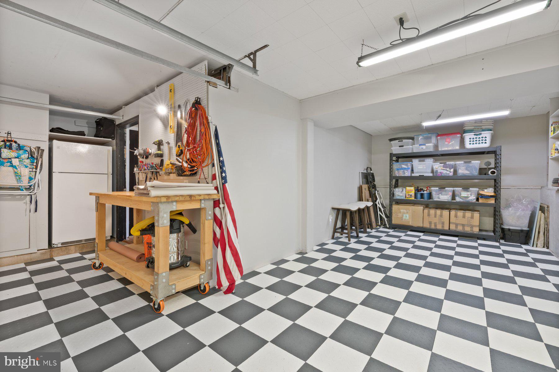 9008 Arley Drive Springfield, VA 22153 - Photo 35 of 40 a room with lots of white walls and black white checkered floor