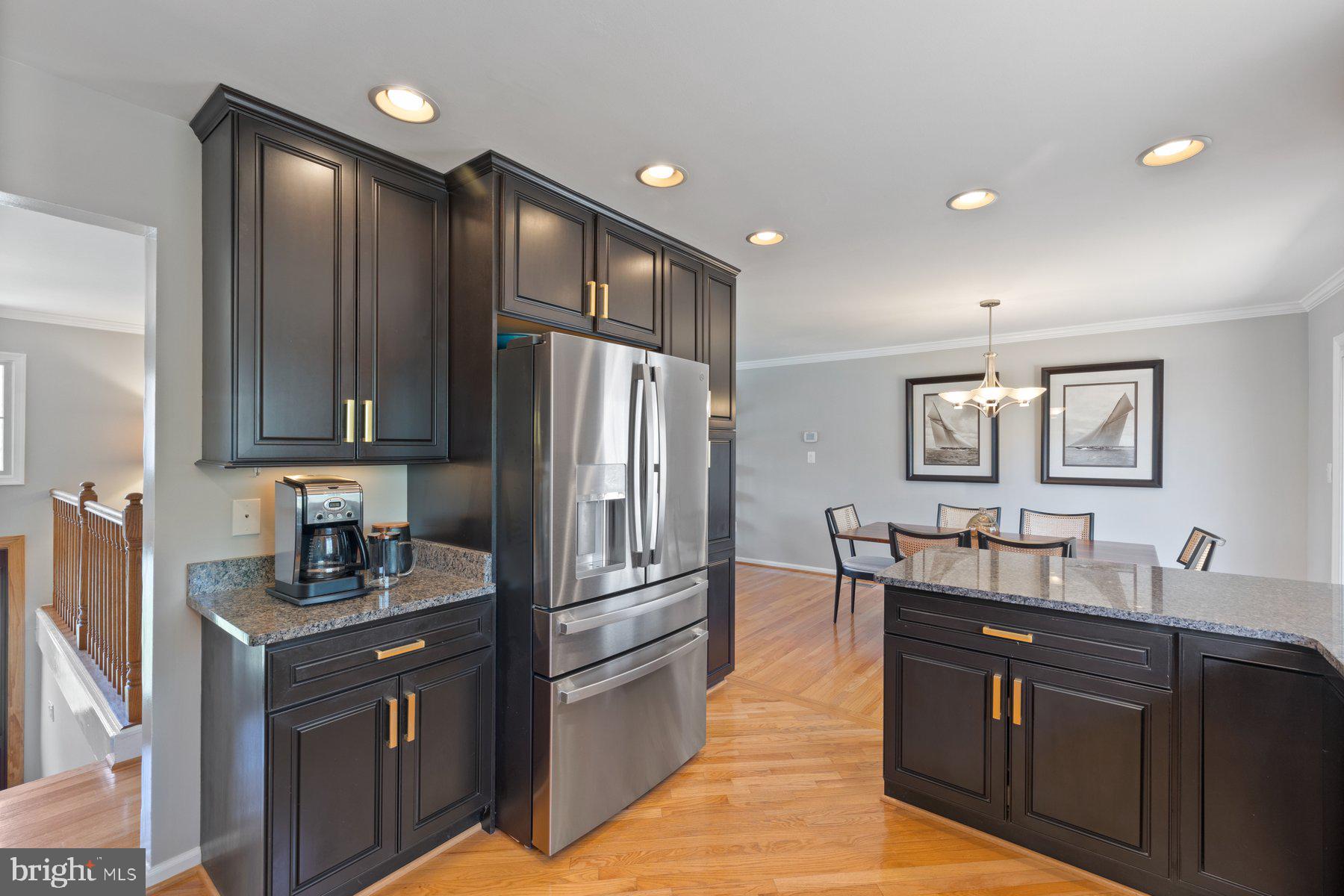 9008 Arley Drive Springfield, VA 22153 - Photo 6 of 40 a kitchen with granite countertop cabinets and refrigerator