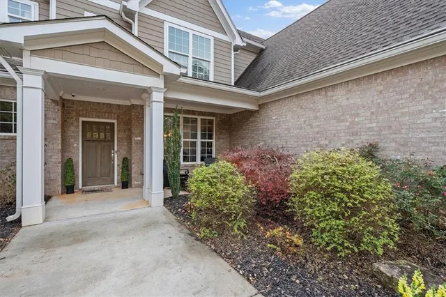 a kitchen with stainless steel appliances kitchen island granite countertop a stove a sink and a refrigerator