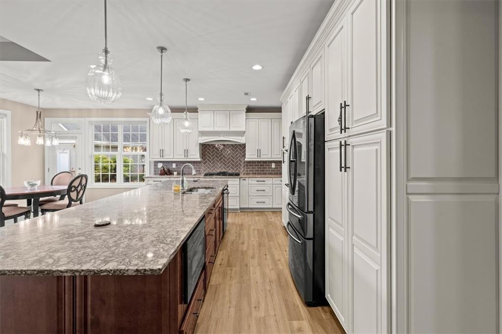 5320 North Helton Road Winston, GA 30187 - Photo 20 of 100 a large kitchen with kitchen island a large counter top space a sink stainless steel appliances and cabinets