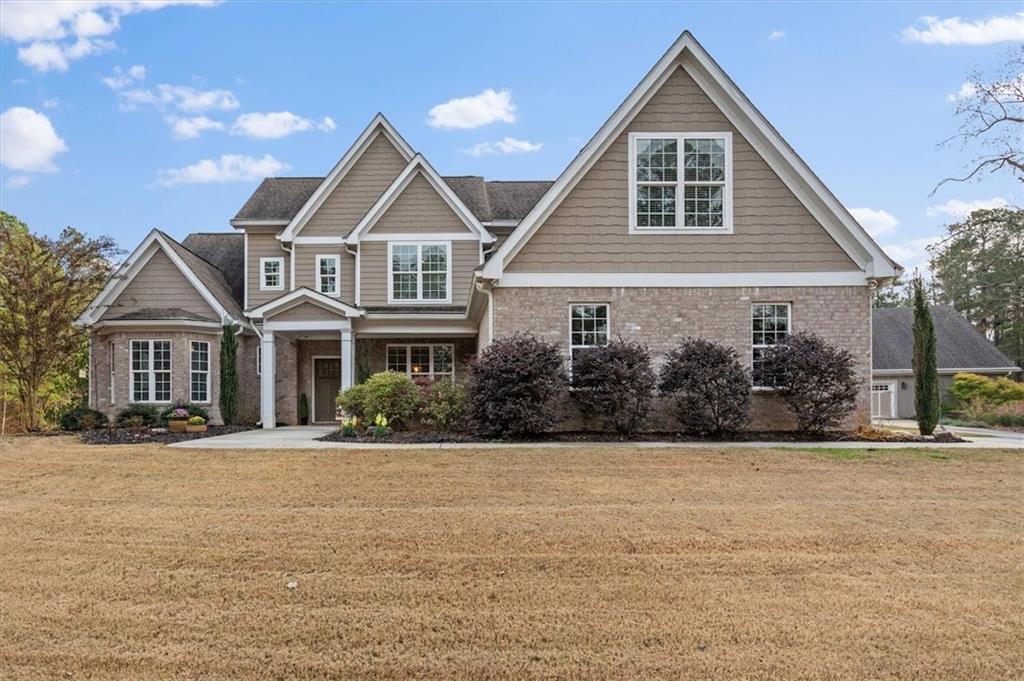 5320 North Helton Road Winston, GA 30187 - Photo 2 of 100 a front view of a house with a yard