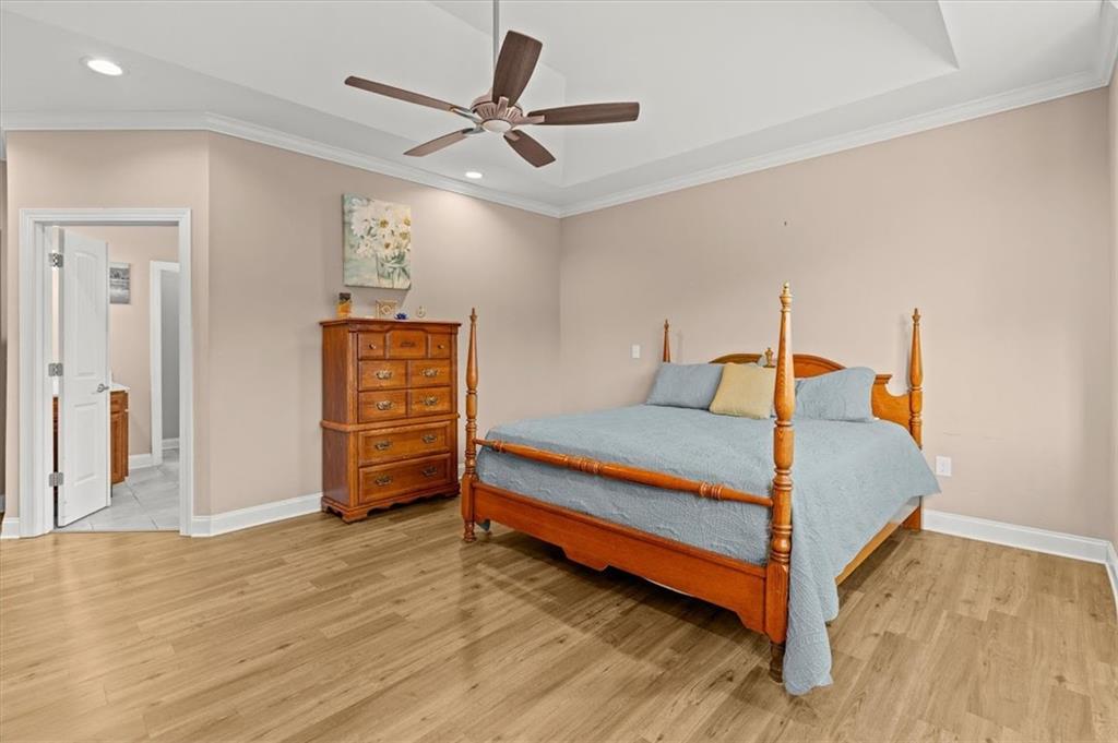 5320 North Helton Road Winston, GA 30187 - Photo 28 of 100 a bedroom with a bed and a chandelier