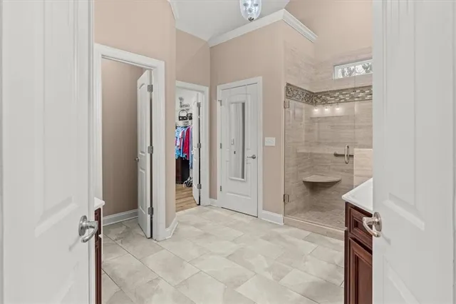 a view of a patio with a table and chairs under an umbrella