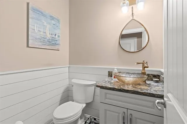 a kitchen with stainless steel appliances granite countertop a sink a stove and a microwave oven