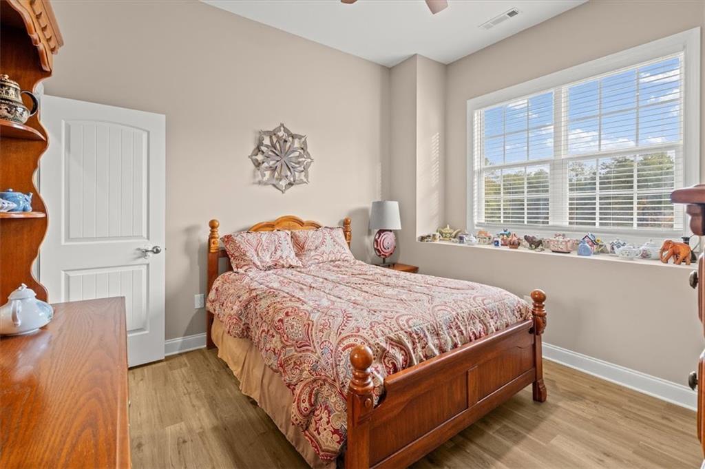 5320 North Helton Road Winston, GA 30187 - Photo 41 of 100 a bedroom with a bed and wooden floor