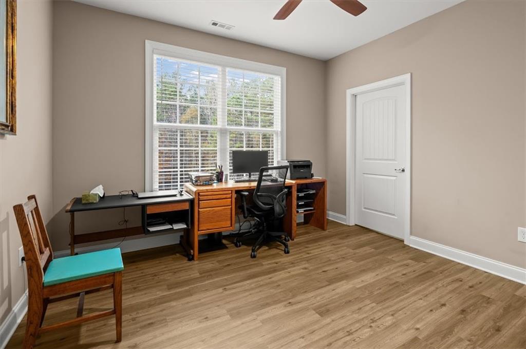 5320 North Helton Road Winston, GA 30187 - Photo 42 of 100 a view of a workspace with furniture and a window