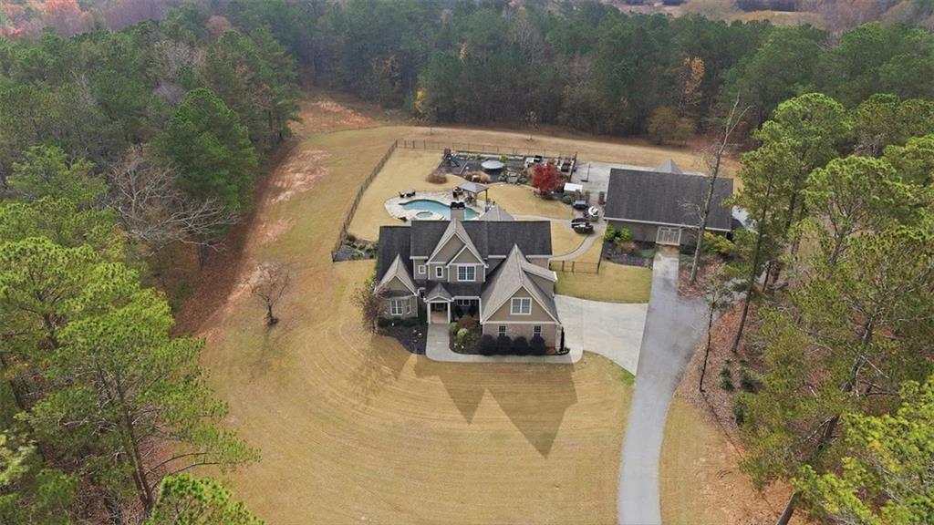 5320 North Helton Road Winston, GA 30187 - Photo 5 of 100 an aerial view of a house with swimming pool and large trees