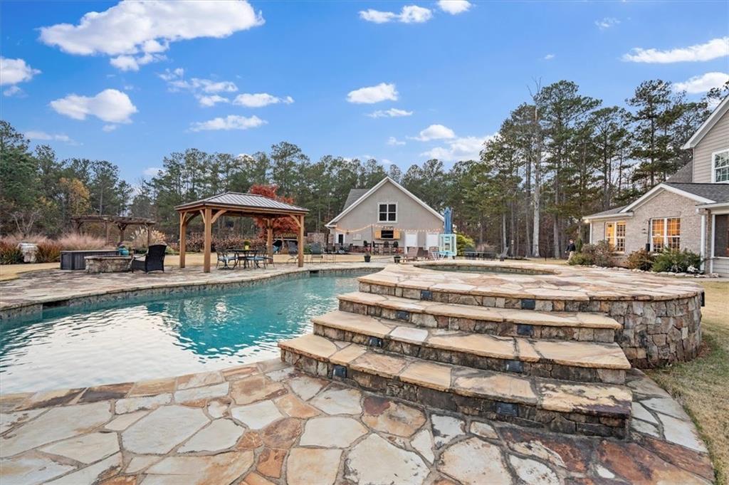 5320 North Helton Road Winston, GA 30187 - Photo 60 of 100 a view of house with outdoor space and sitting area