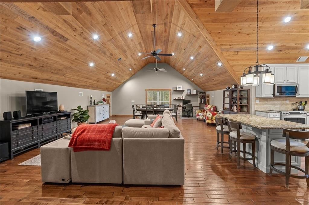 5320 North Helton Road Winston, GA 30187 - Photo 66 of 100 a living room with furniture and a flat screen tv
