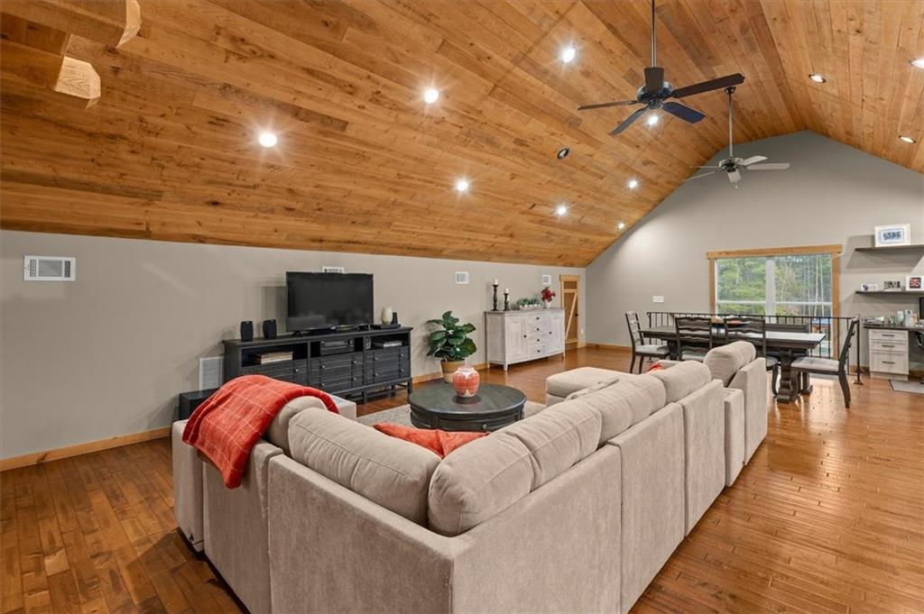 5320 North Helton Road Winston, GA 30187 - Photo 74 of 100 a living room with furniture a flat screen tv and a table