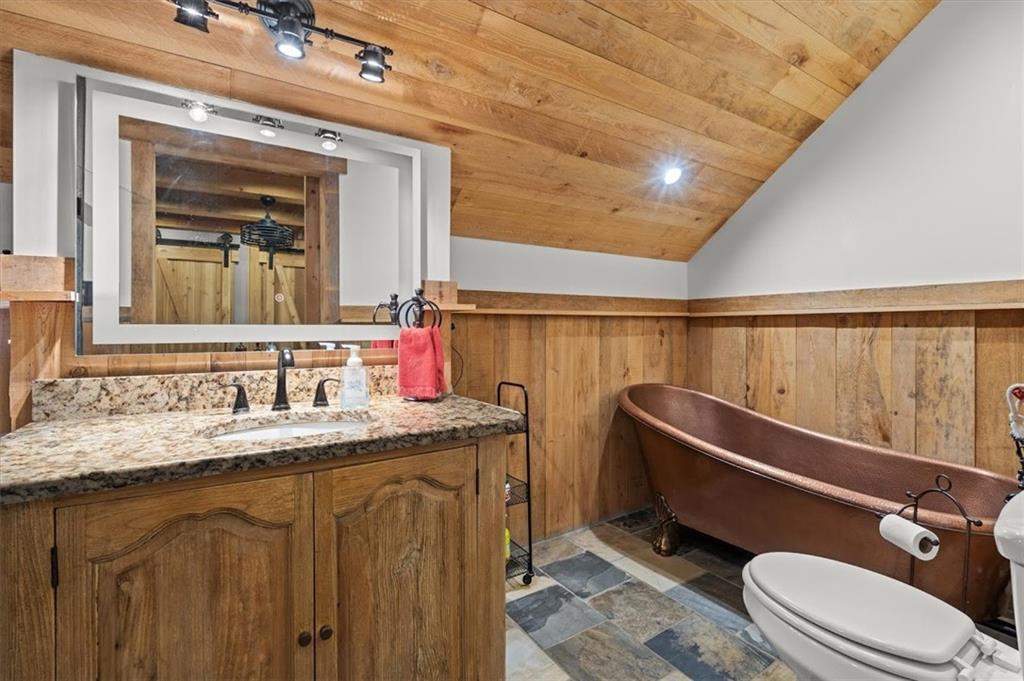 5320 North Helton Road Winston, GA 30187 - Photo 80 of 100 a bathroom with a granite countertop sink mirror vanity and toilet