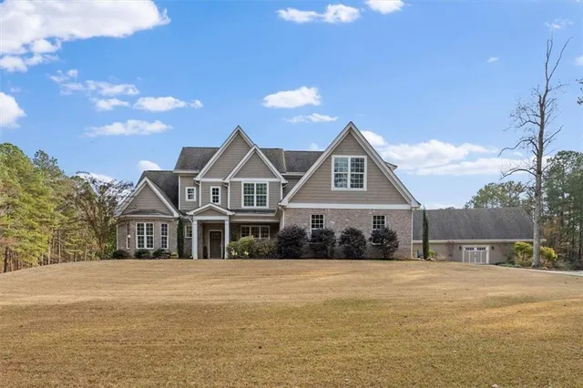 a kitchen with stainless steel appliances granite countertop a stove refrigerator and cabinets