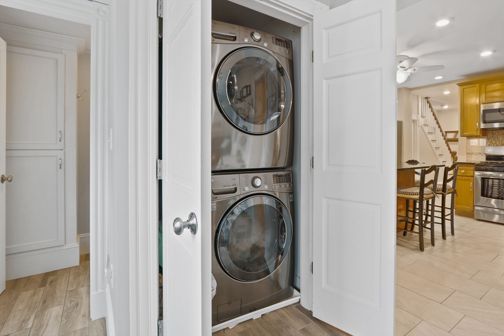 42 Partridge Street Boston, MA 02132 - Photo 11 of 33 a view of a hallway with washer and dryer