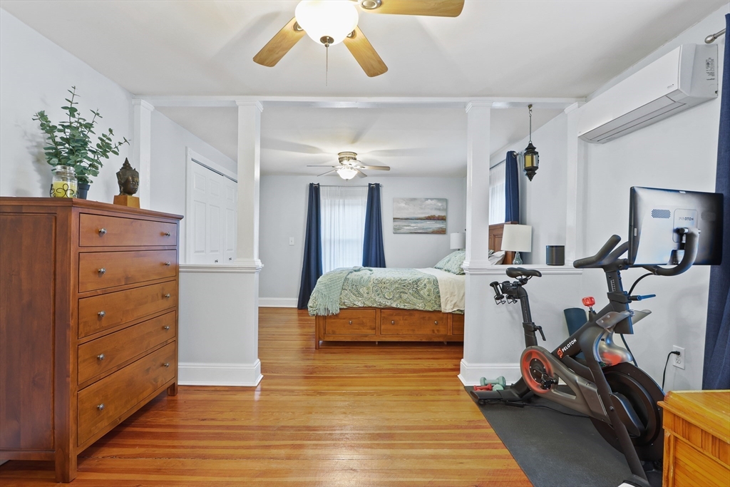 42 Partridge Street Boston, MA 02132 - Photo 13 of 33 a bedroom with a bed and wooden floor