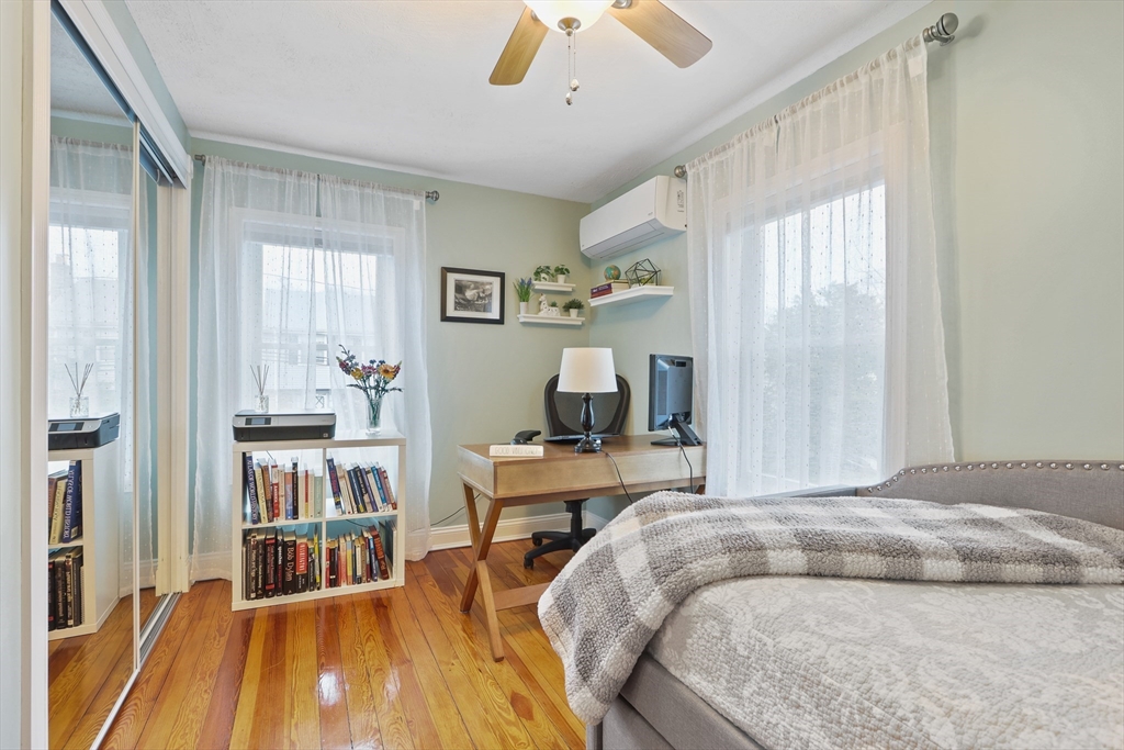 42 Partridge Street Boston, MA 02132 - Photo 19 of 33 a bedroom with a bed and a large window