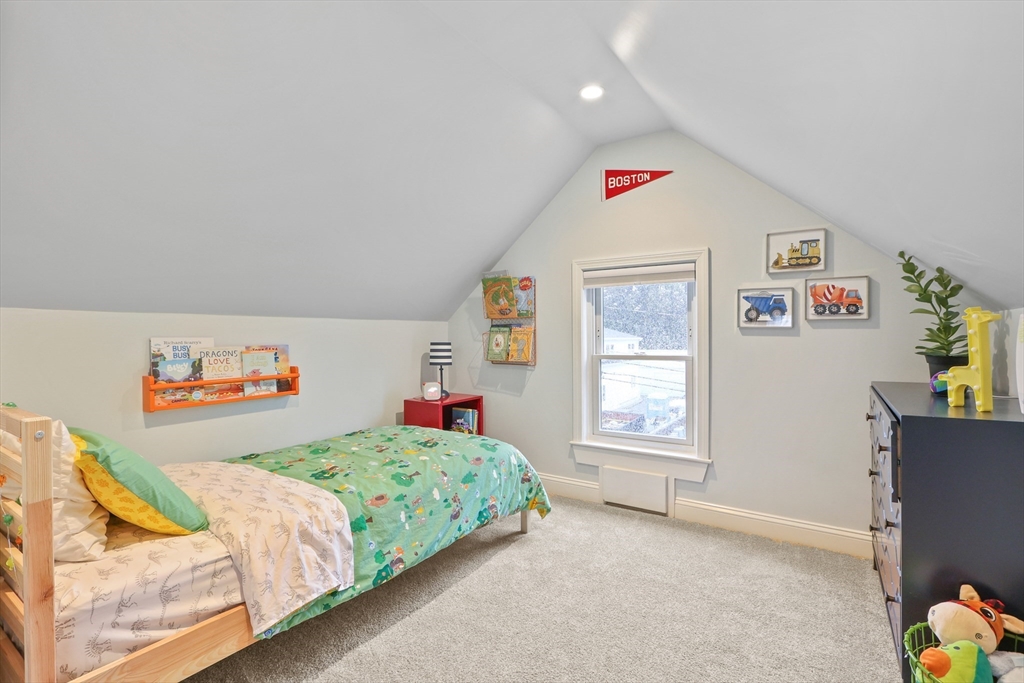 42 Partridge Street Boston, MA 02132 - Photo 22 of 33 a bedroom with a bed and a window