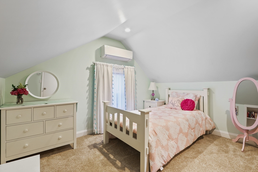 42 Partridge Street Boston, MA 02132 - Photo 24 of 33 a bedroom with a bed a dresser and baby crib