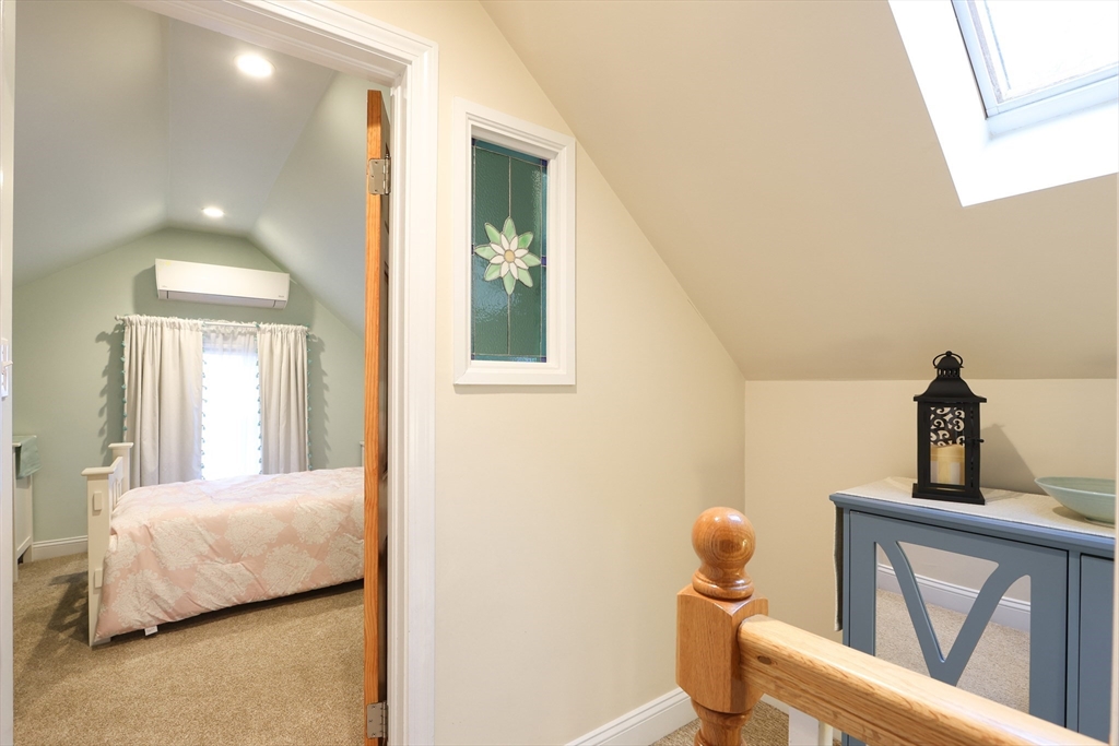 42 Partridge Street Boston, MA 02132 - Photo 25 of 33 a bedroom with a bed and a window
