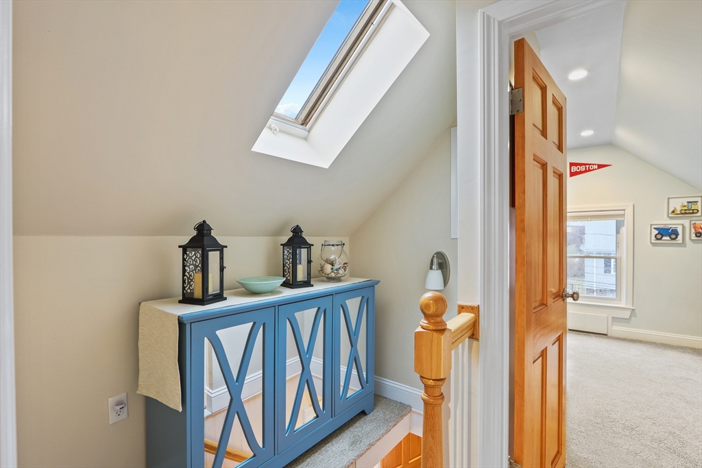 42 Partridge Street Boston, MA 02132 - Photo 26 of 33 a view of staircase with railing and a chandelier