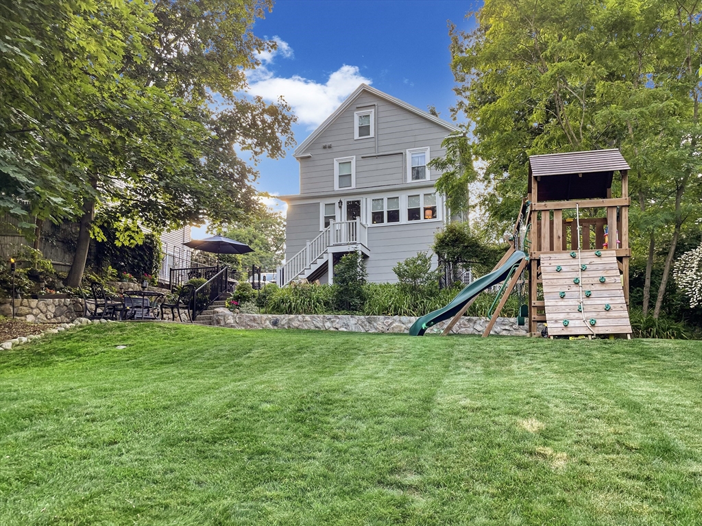 42 Partridge Street Boston, MA 02132 - Photo 28 of 33 a front view of a house with a yard and trees