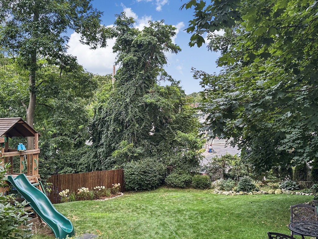 42 Partridge Street Boston, MA 02132 - Photo 29 of 33 a view of a house with a yard and a tree