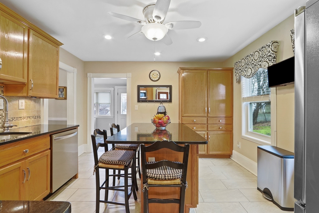 42 Partridge Street Boston, MA 02132 - Photo 3 of 33 a view of a dining room with furniture window and wooden floor