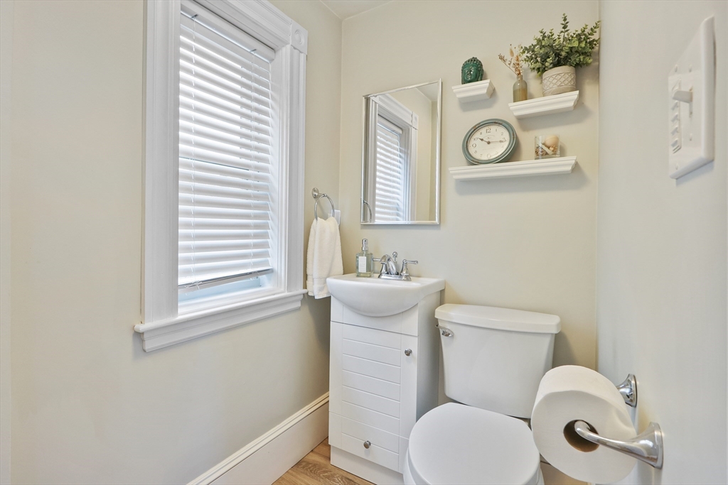 42 Partridge Street Boston, MA 02132 - Photo 10 of 33 a white toilet sitting next to a bathroom sink