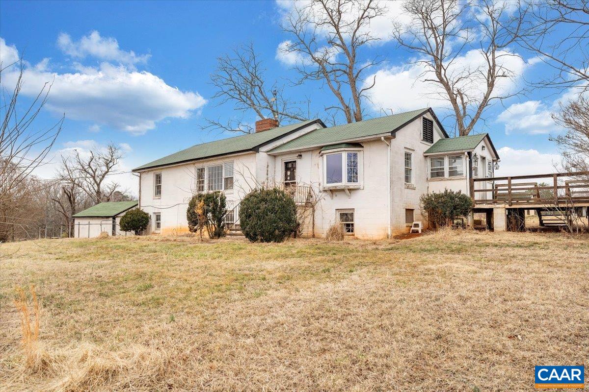 2420 James River Road Esmont, VA 22937 - Photo 11 of 75 a front view of a house with a yard and garage