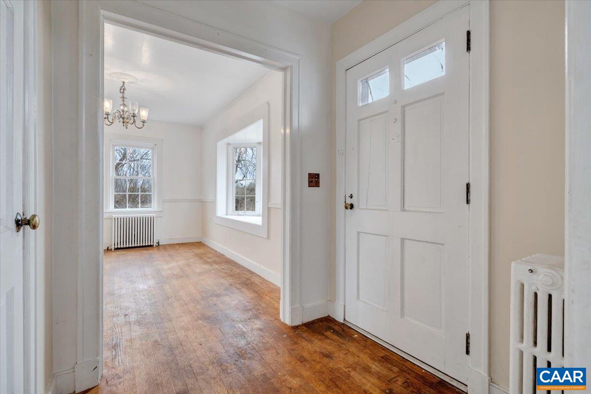 2420 James River Road Esmont, VA 22937 - Photo 12 of 75 an empty room with windows and hardwood floor