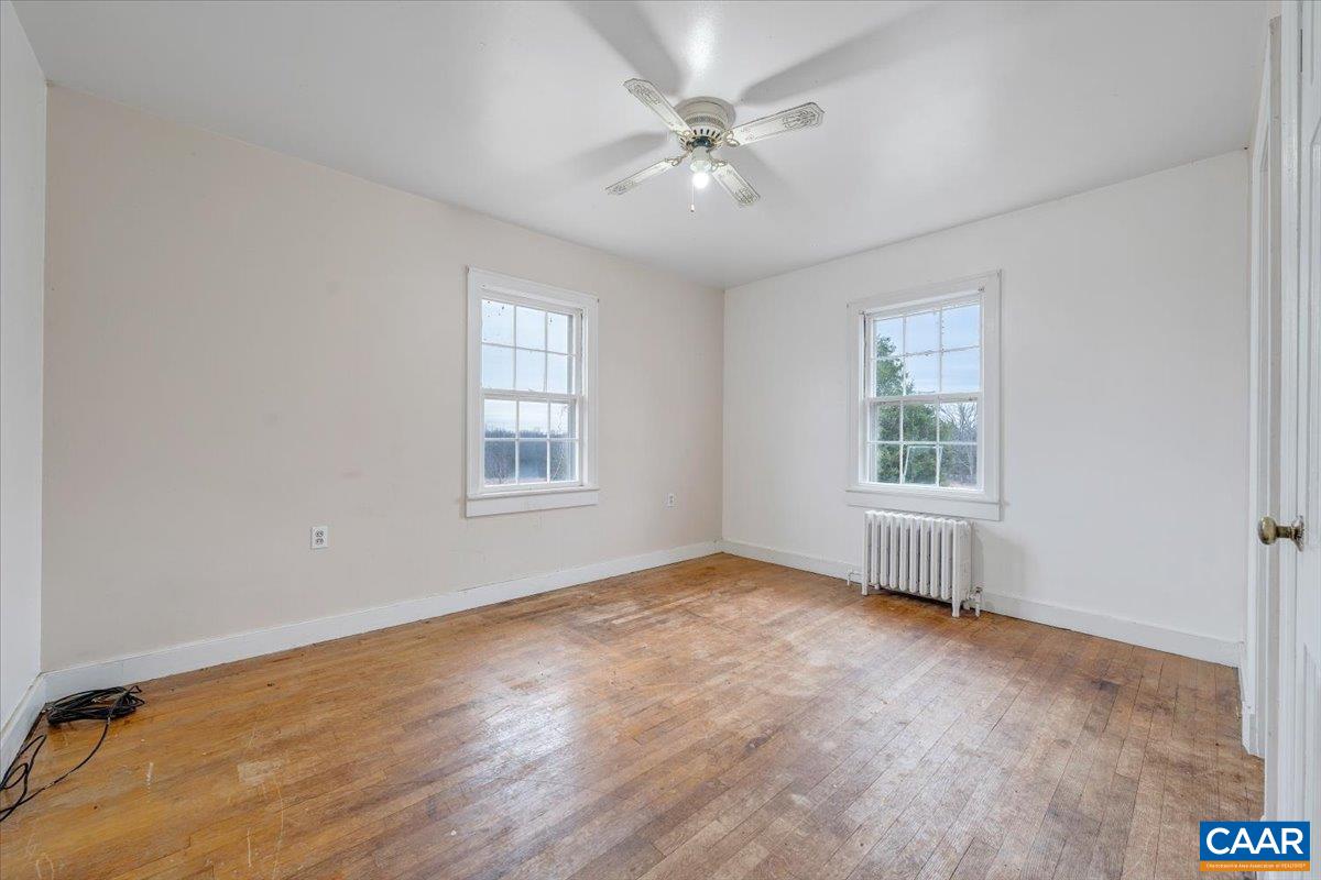 2420 James River Road Esmont, VA 22937 - Photo 21 of 75 wooden floor in an empty room with a window