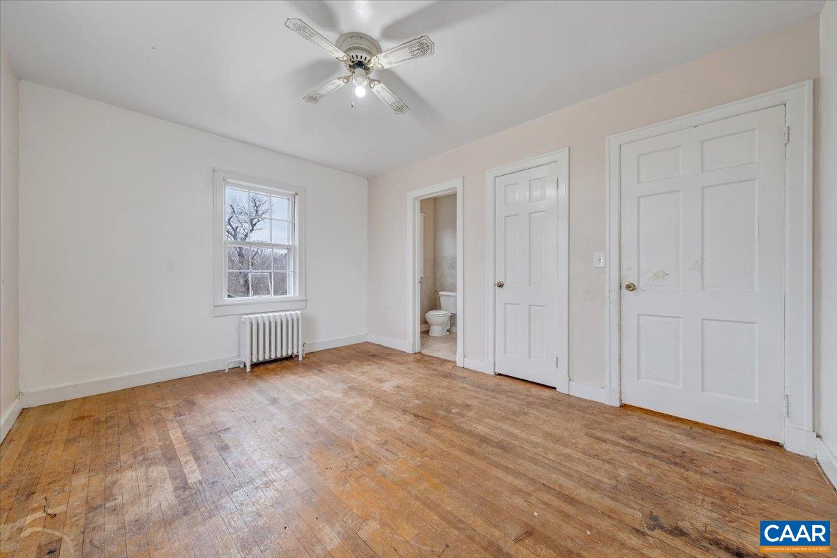 2420 James River Road Esmont, VA 22937 - Photo 22 of 75 a view of empty room with wooden floor and fan
