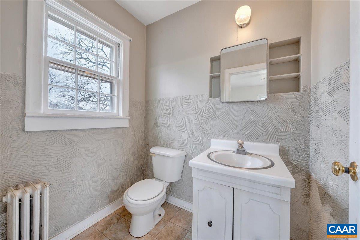 2420 James River Road Esmont, VA 22937 - Photo 23 of 75 a bathroom with a toilet sink and mirror