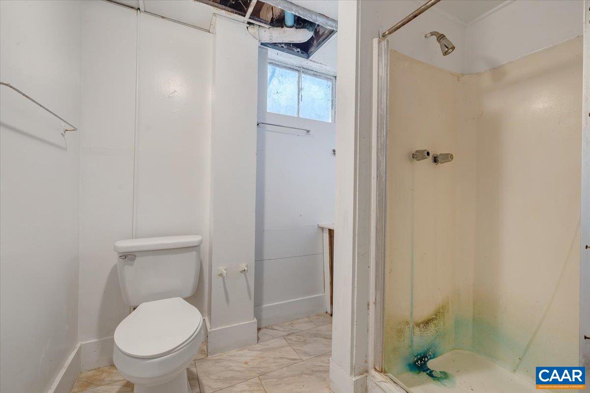 2420 James River Road Esmont, VA 22937 - Photo 34 of 75 a bathroom with a toilet and a shower