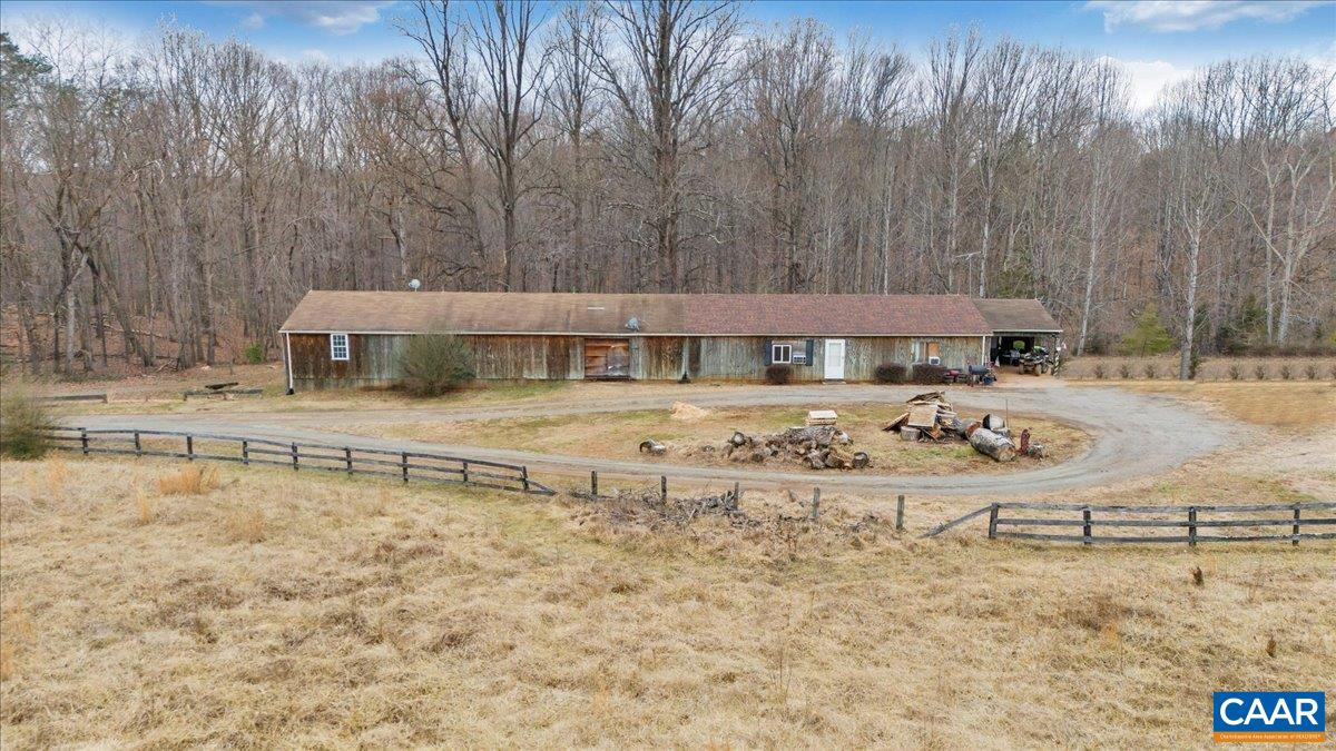 2420 James River Road Esmont, VA 22937 - Photo 43 of 75 a view of a backyard with a patio and fire pit