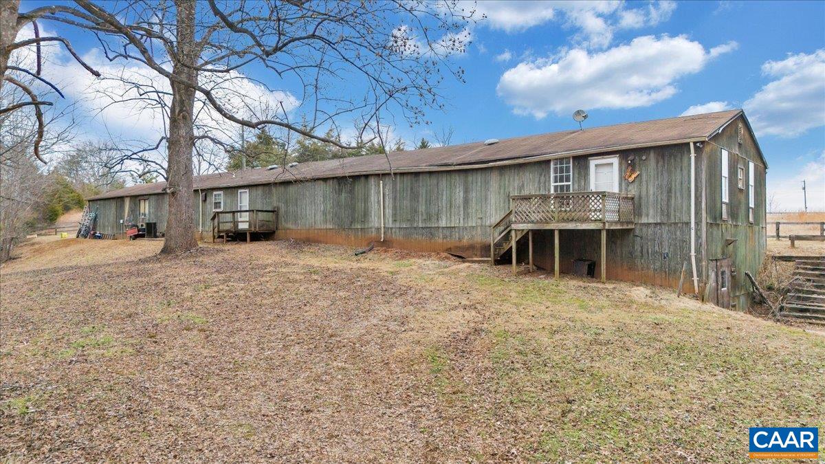 2420 James River Road Esmont, VA 22937 - Photo 45 of 75 a backyard of a house with table and chairs