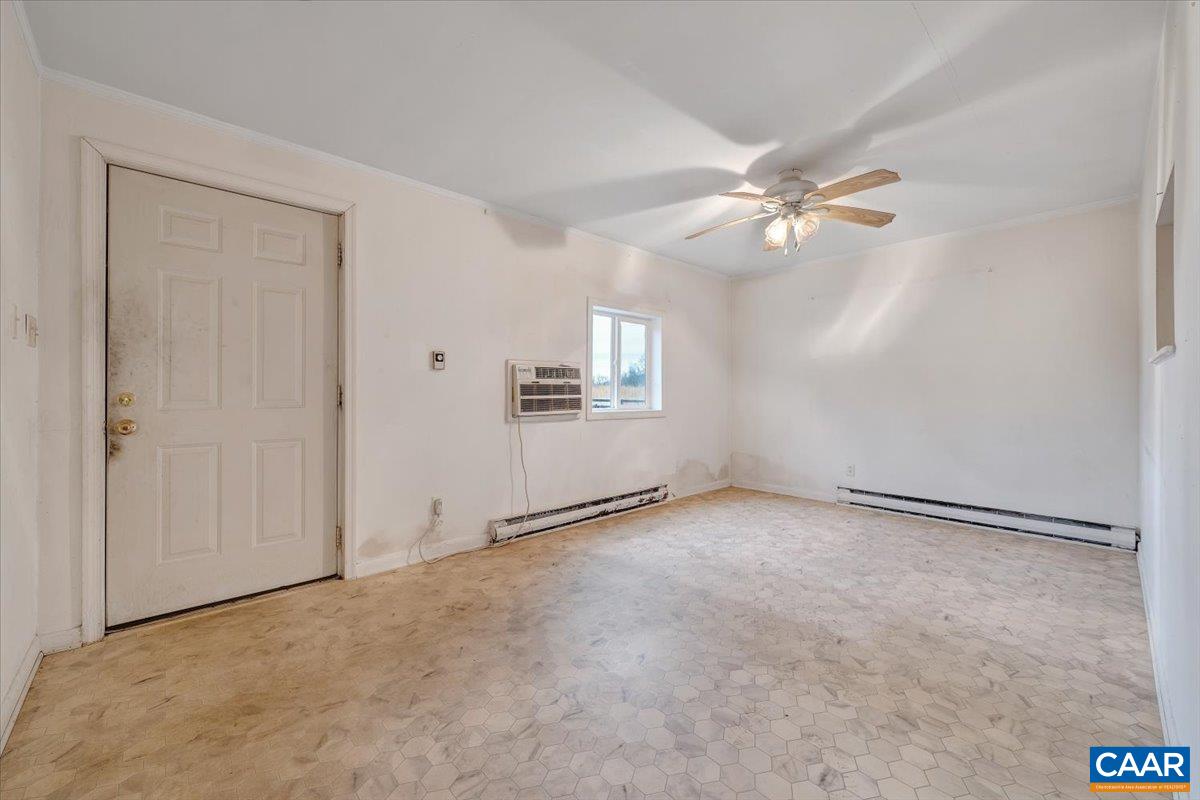 2420 James River Road Esmont, VA 22937 - Photo 49 of 75 an empty room with windows and fan