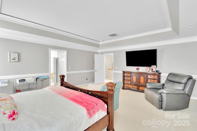 a kitchen with stainless steel appliances kitchen island a white cabinets and a glass door